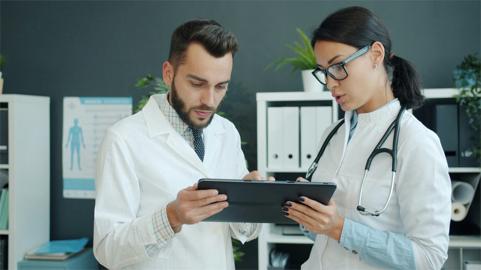 HIPAA-Compliant Software: 9 Critical Wins for Providers 19 two healthcare professionals reviewing a tablet to evaluate cloud vendors and business associate agreements