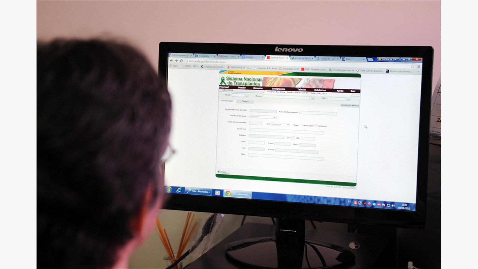 hospital computer screen for identity MFA and role-based access in HIPAA file sharing