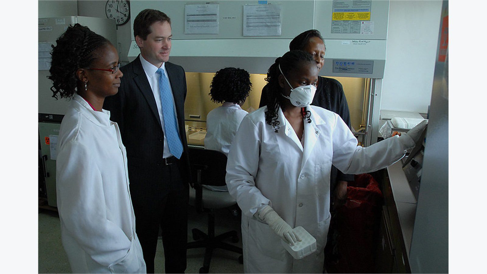 clinic staff training around a workstation to test HIPAA-compliant remote file sharing workflows