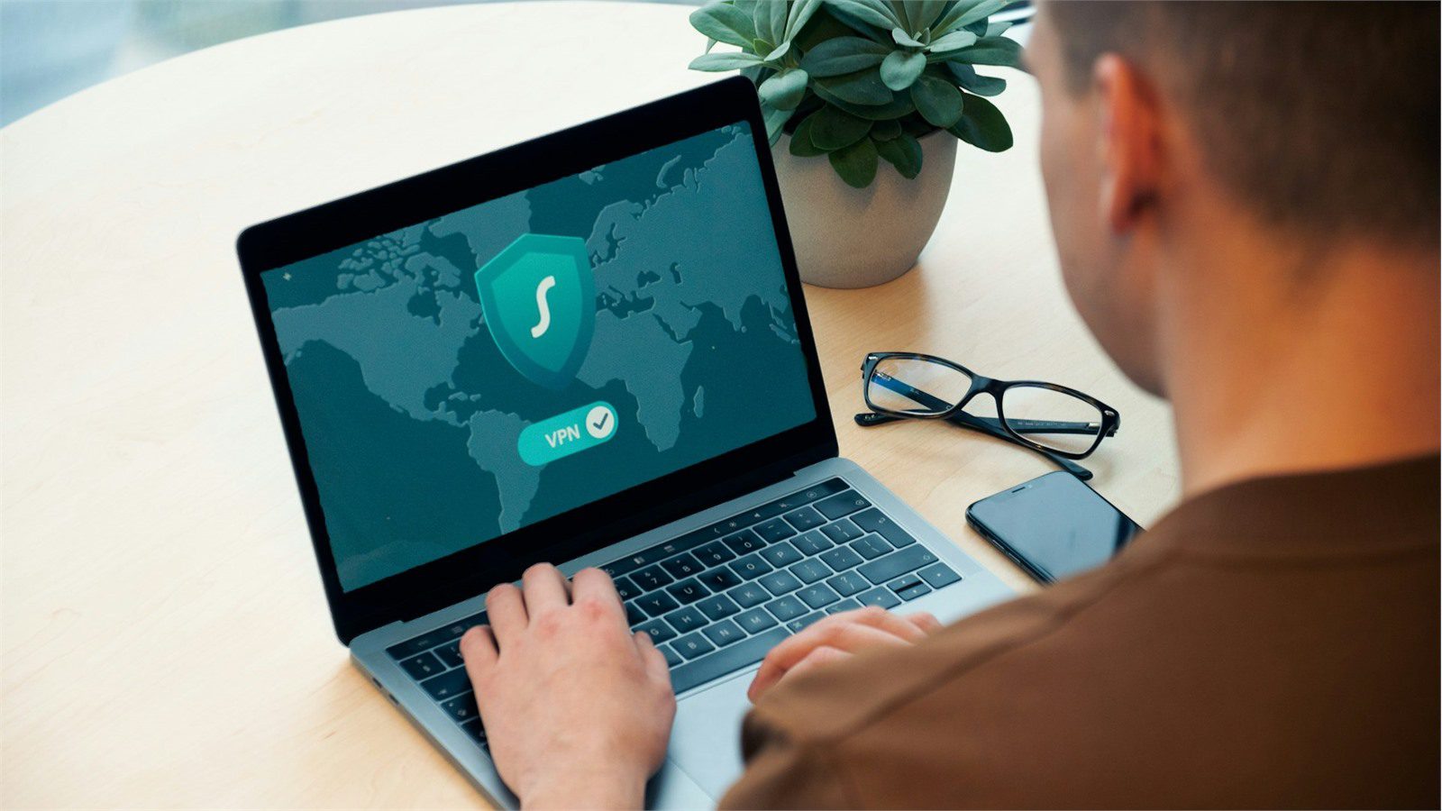 Identity-Aware Access: 7 Secure Steps Beyond VPN 11 remote worker laptop showing why traditional VPN access is failing modern teams