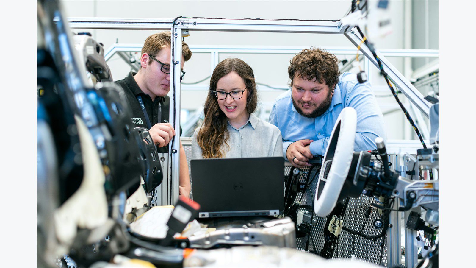 IoT Sensors for Predictive Maintenance: 9 Powerful Wins 21 engineering team reviewing laptop data to prove predictive maintenance ROI before scaling