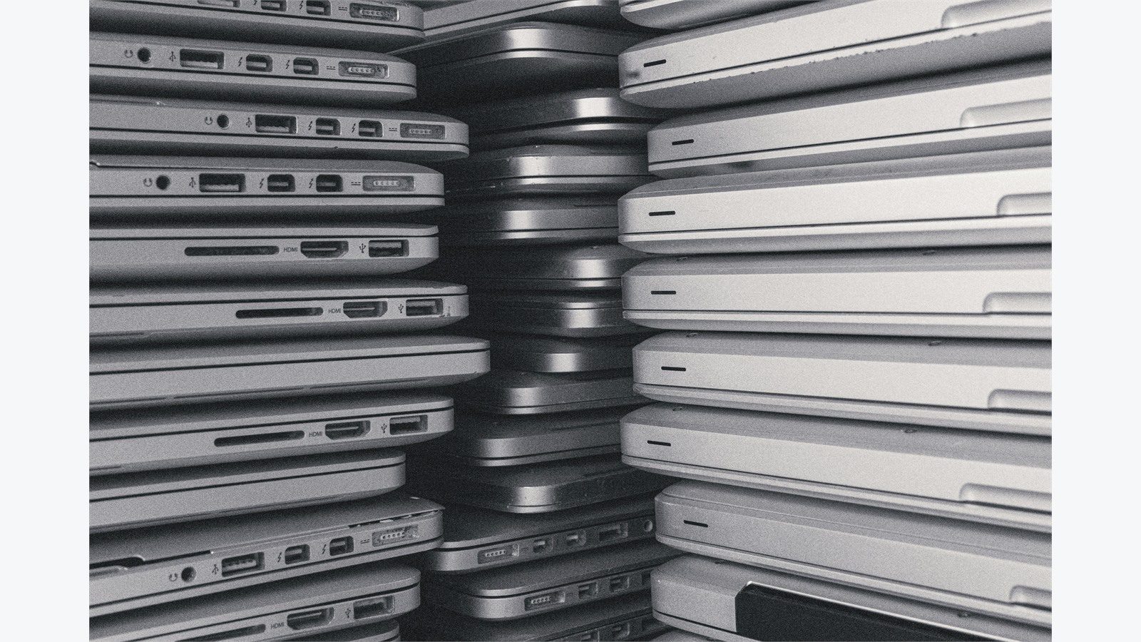 IT Infrastructure Health Audit: 9 Powerful Fixes Fast 15 rows of laptop computers representing asset inventory applications and infrastructure dependencies