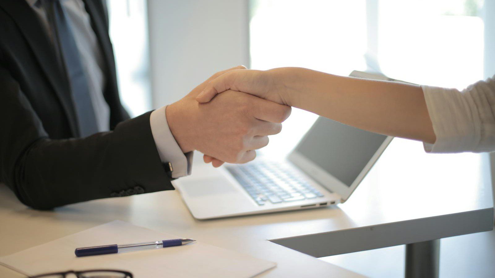The IT Skills Gap: How an MSP Gives You Instant Access to Top-Tier Tech Talent 9 IT skills gap: professionals reviewing cost and performance charts together.
