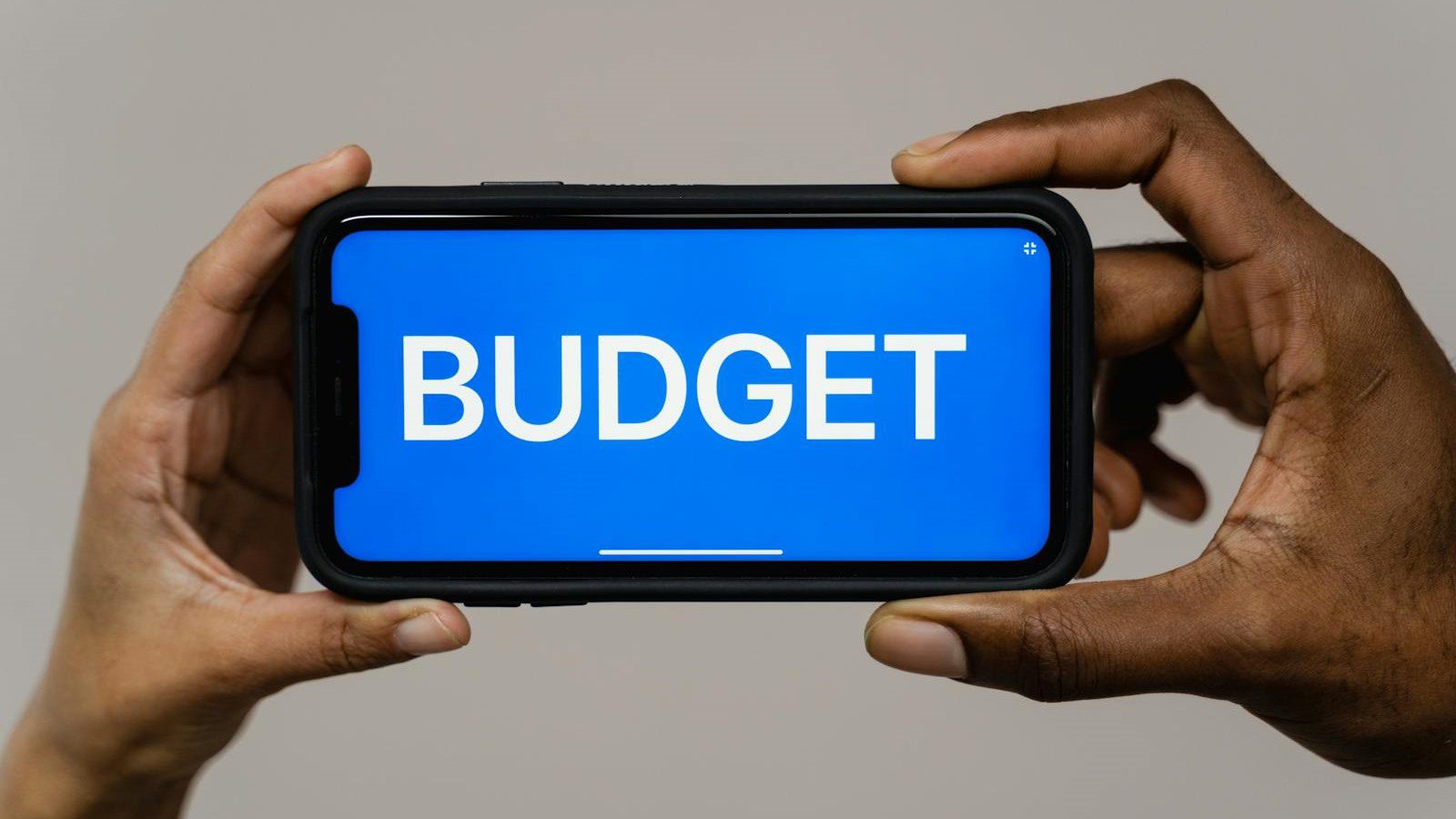 IT Spending Case Study: 7 Proven Ways We Cut Costs 30% 14 smartphone budget screen representing SaaS cloud and license waste removal