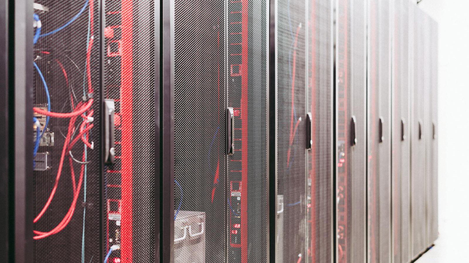 Legacy Databases: server racks representing legacy data infrastructure modernization