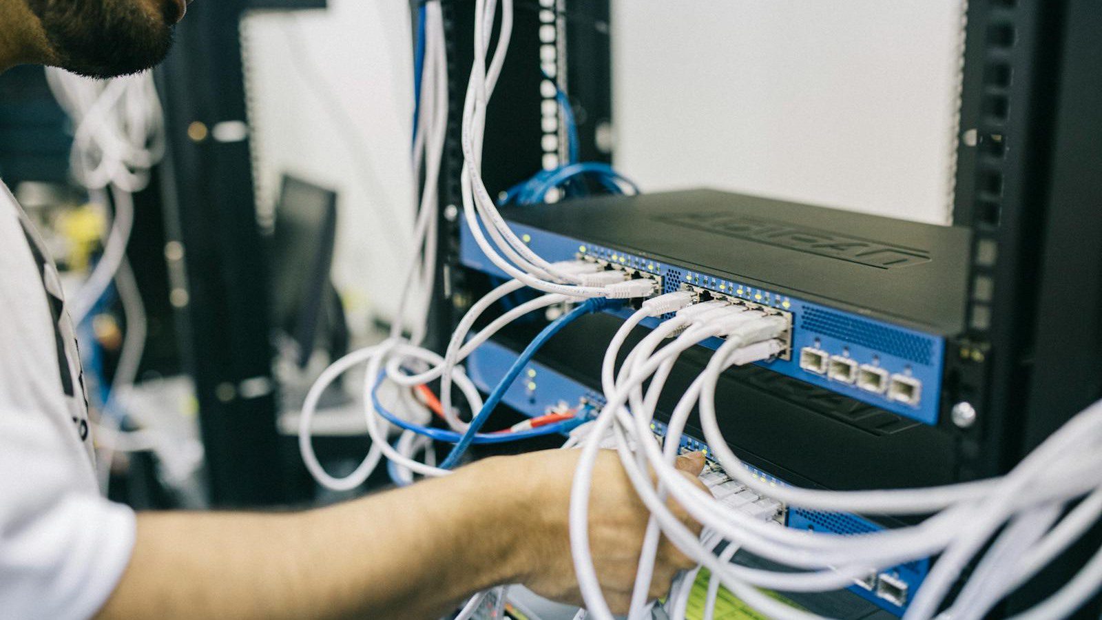 network rack showing legacy infrastructure constraints behind business system bottlenecks