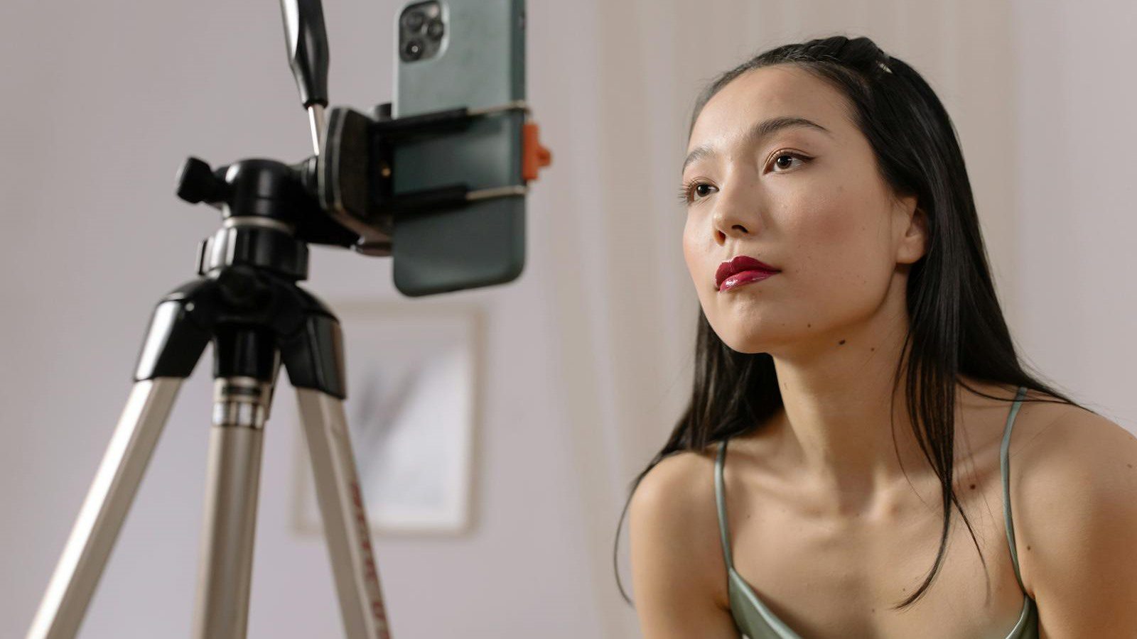 LiveSwap Review: 7 Smart Real-Time Face Swap Wins 14 simple creator setup with smartphone tripod representing fast no plugin onboarding