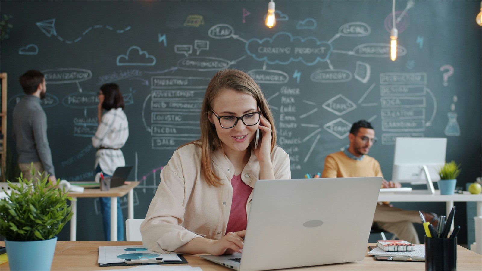business professional reviewing laptop costs for managed IT software cloud and vendor spend control