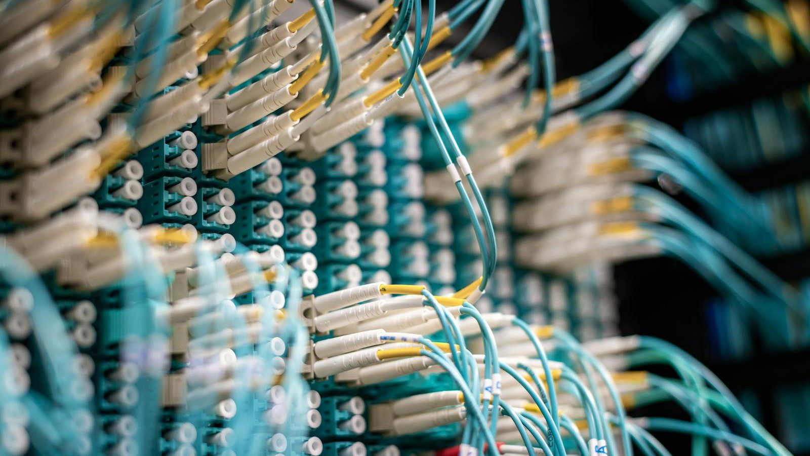 milvus vs qdrant horizontal scaling vector database sharding: fiber optic switch fabric representing distributed vector database shards