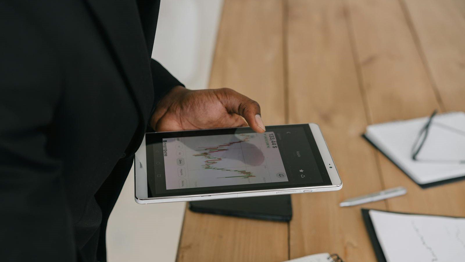 Mistral Medium 3.5: 7 Powerful AI Wins for 2026 17 businessperson reviewing tablet data representing enterprise AI governance and rollout risks
