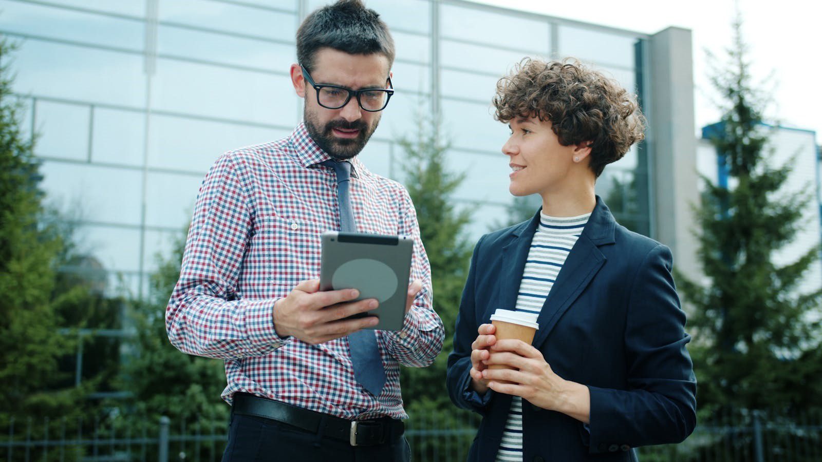 Mistral Medium 3.5: 7 Powerful AI Wins for 2026 13 professionals using a tablet outdoors representing remote AI coding agents and productivity