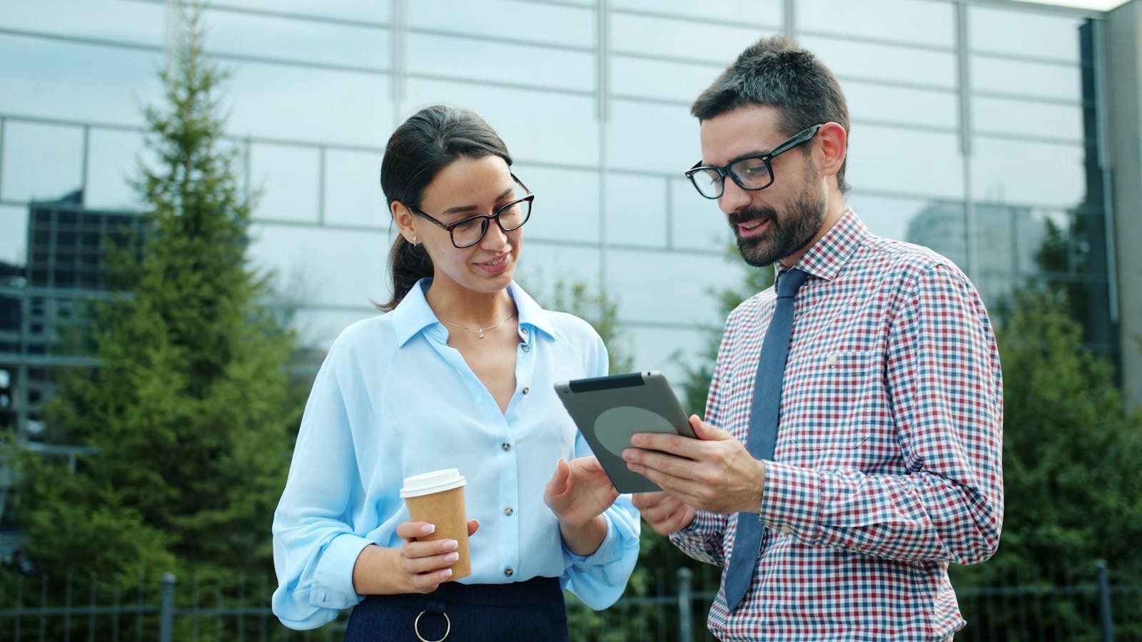 professionals collaborating with a tablet representing vibe coding and AI tool integrations