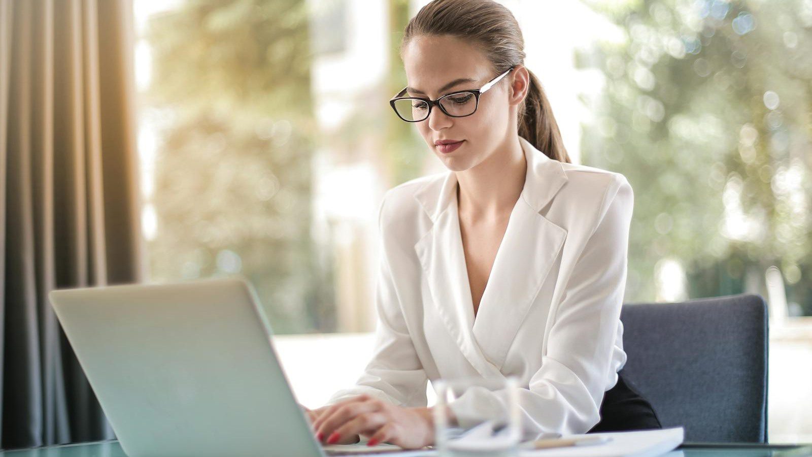 Outgrown IT Setup? 10 Warning Signs to Fix Fast 13 business professional using a laptop for outgrown IT setup FAQ and modernization questions