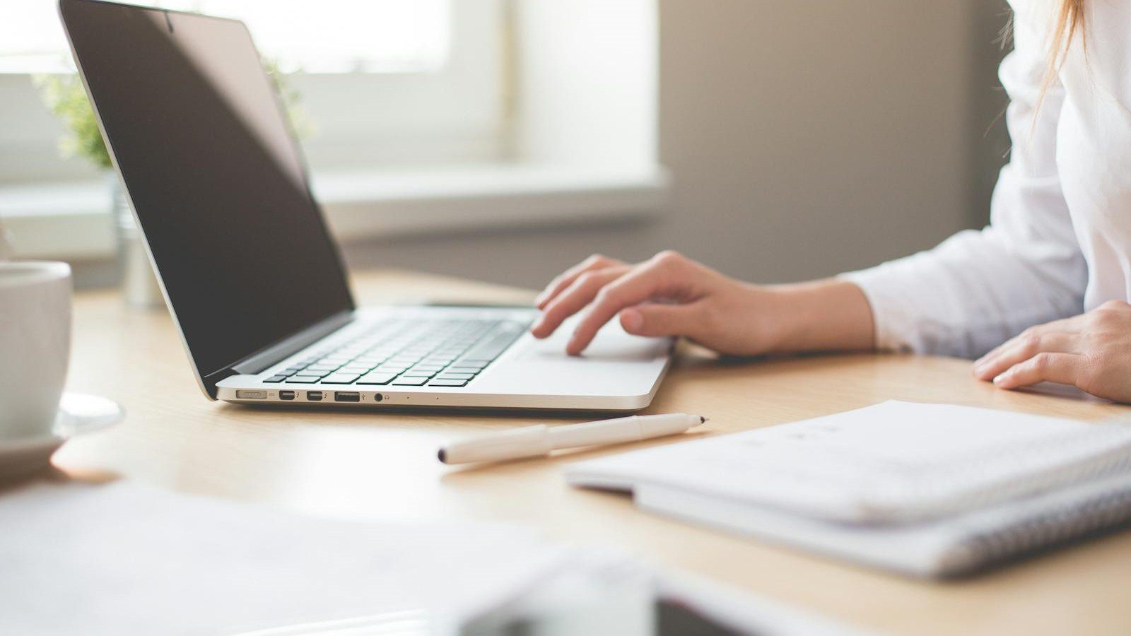 Outgrown IT Setup? 10 Warning Signs to Fix Fast 9 laptop and office notes representing slow systems downtime and daily IT reliability problems