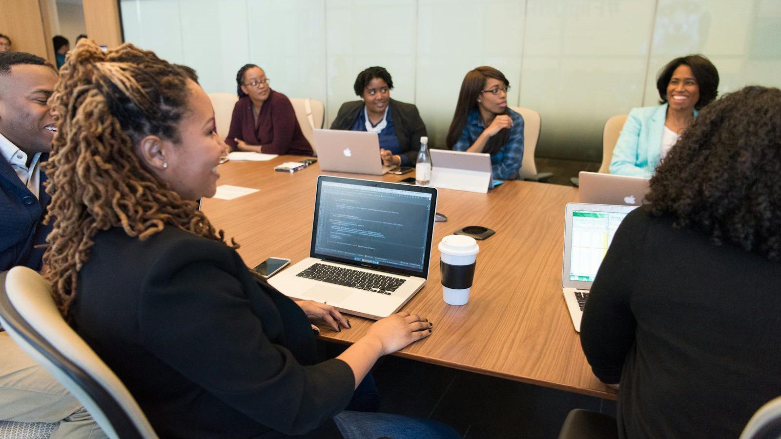 Outgrown IT Setup? 10 Warning Signs to Fix Fast 10 technology team using laptops to review security support tickets and system integration gaps