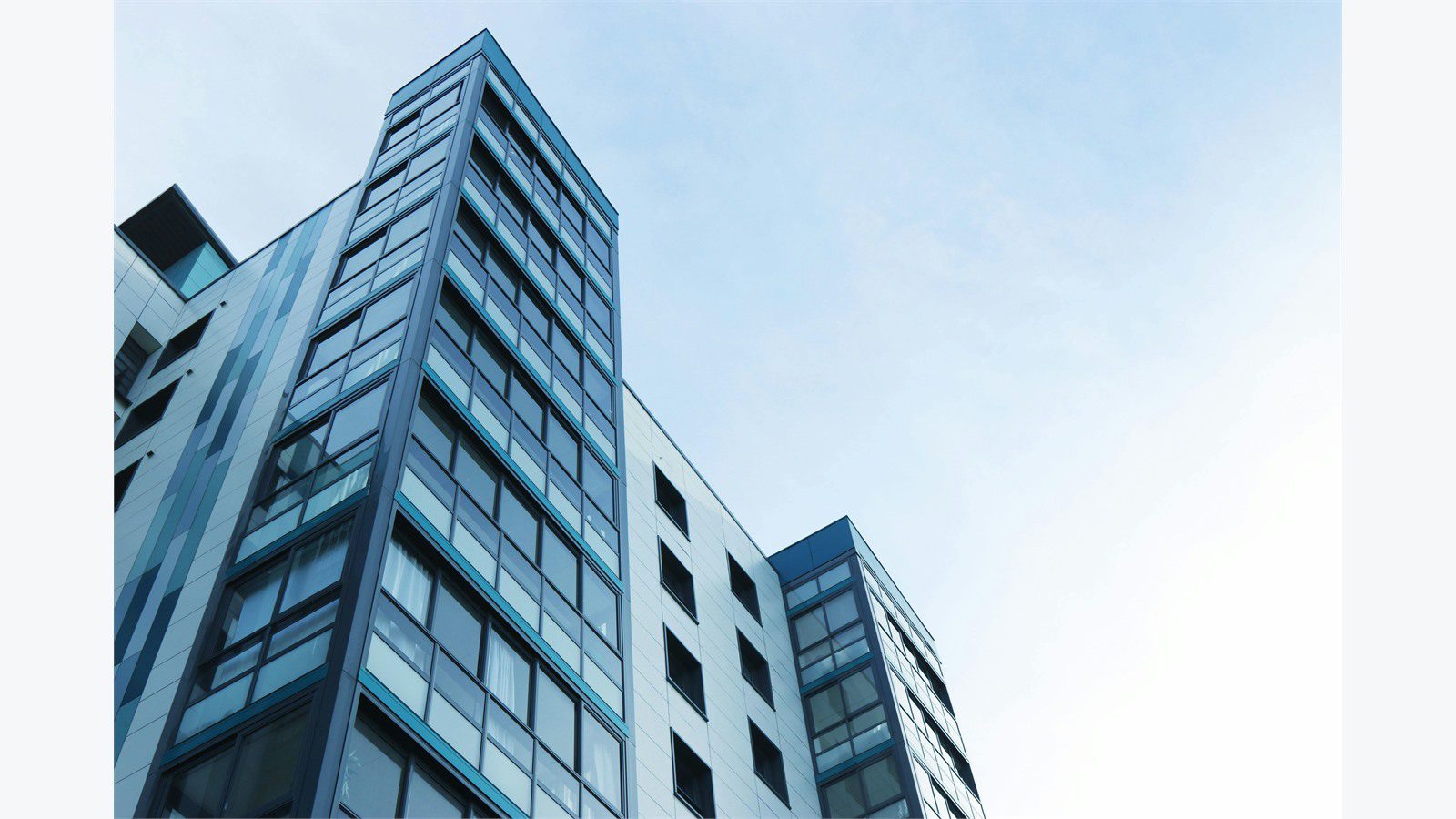 apartment building representing a cloud property management system as the source of truth