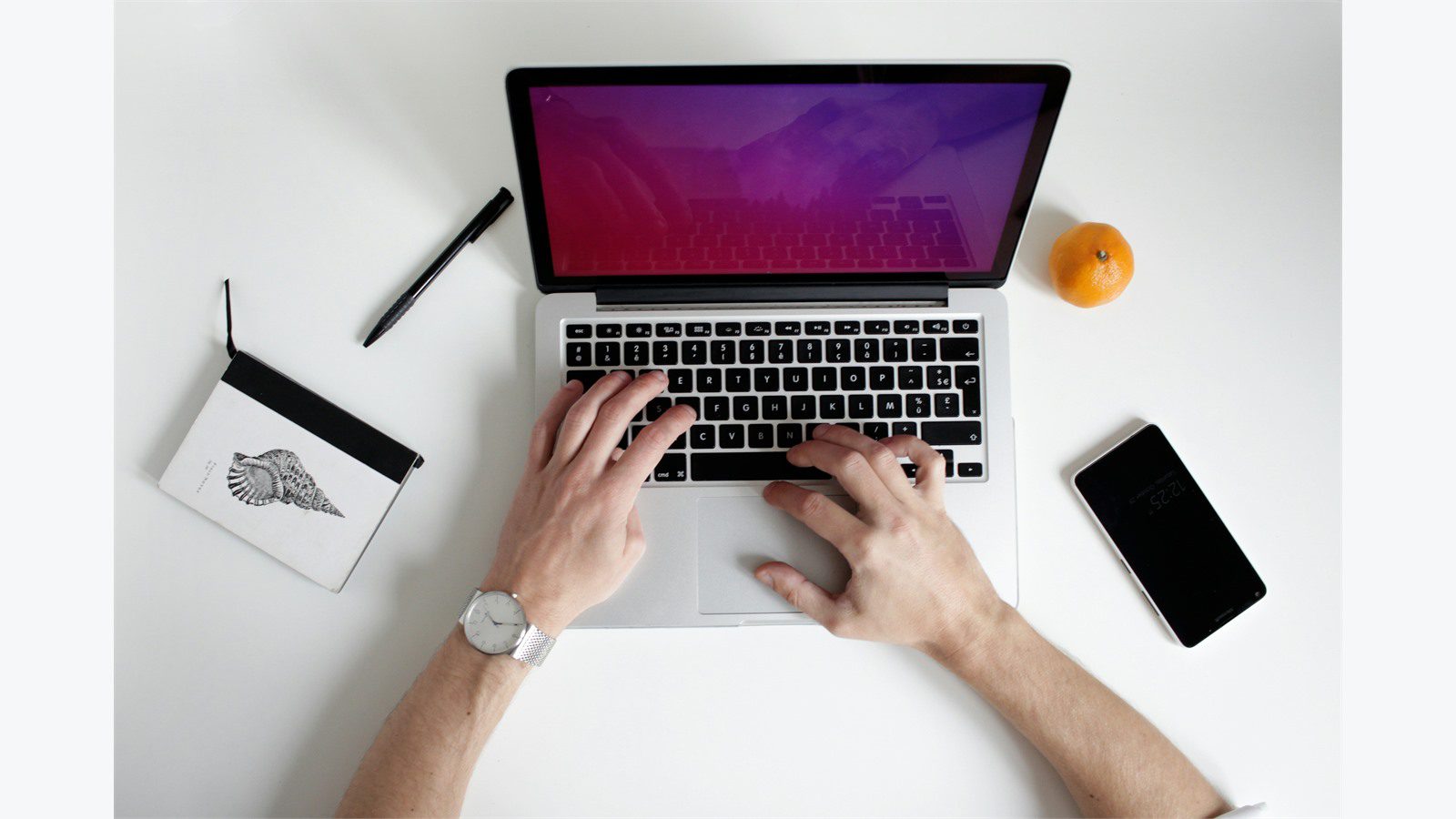 Remote Worker Laptops: 9 Easy Ways to Secure Them 22 person using a laptop representing compliance monitoring and lost device response