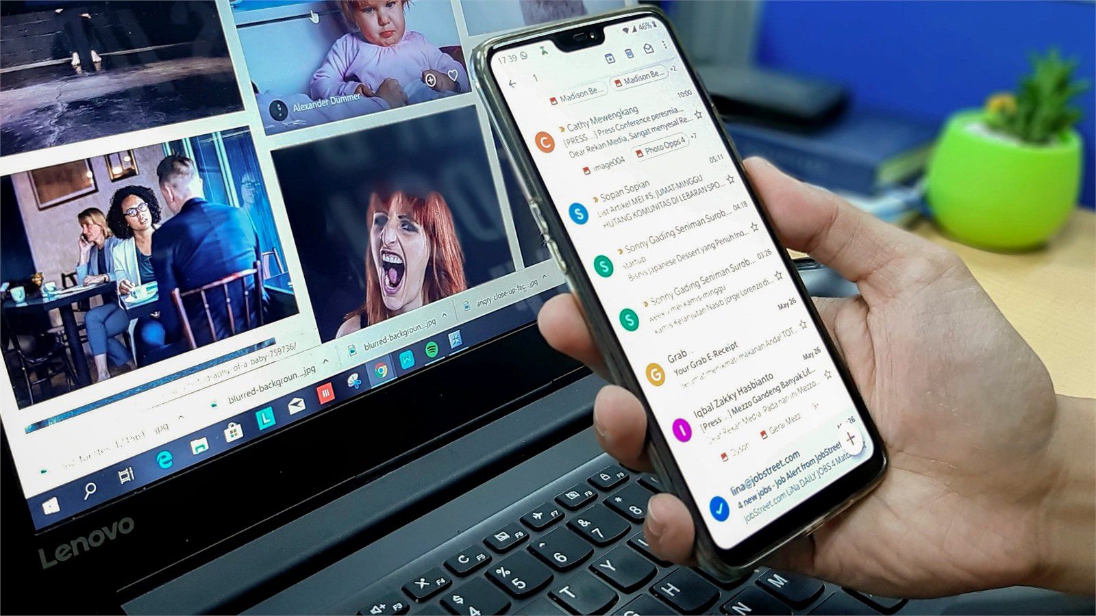 Remote Worker Laptops: 9 Easy Ways to Secure Them 14 person using a smartphone and laptop to support MFA sign in for remote work security