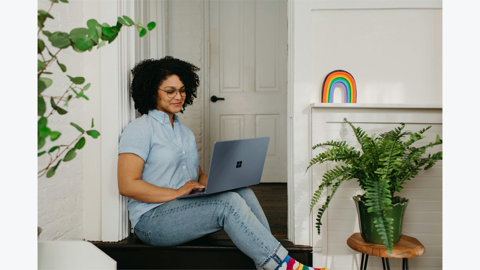 Remote Worker Laptops: 9 Easy Ways to Secure Them 19 person working from home on a laptop representing separation of work data and personal use