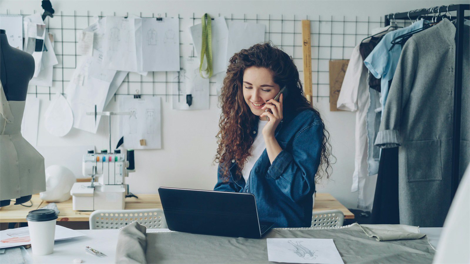 Retail Cyber Theft: 7 Proven Defenses for Local Stores 13 boutique owner using a laptop near store equipment to secure Wi-Fi devices software and connected retail systems