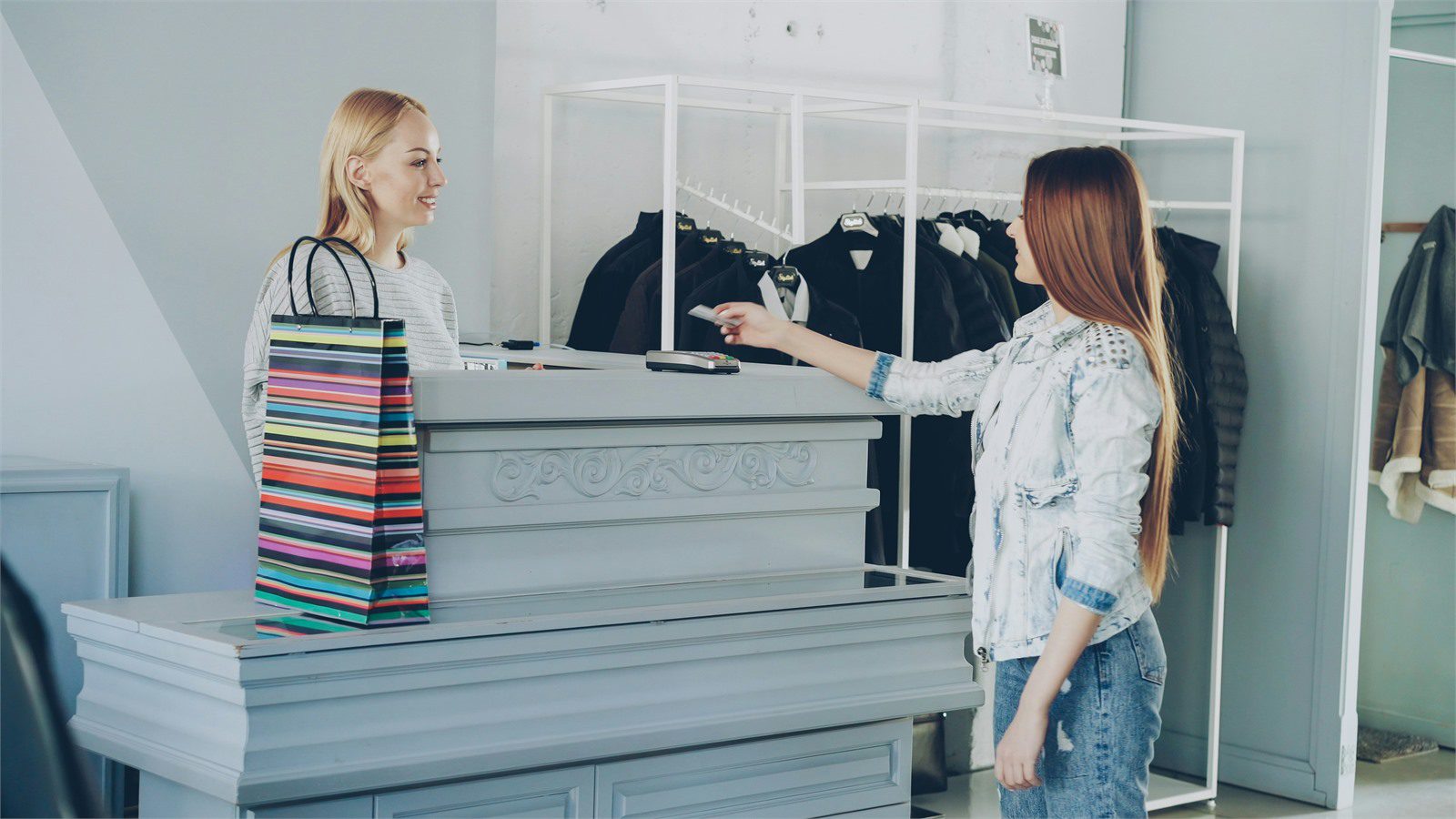 Retail Cyber Theft: 7 Proven Defenses for Local Stores 10 customer paying by credit card at a local store checkout for retail cyber theft payment workflow protection