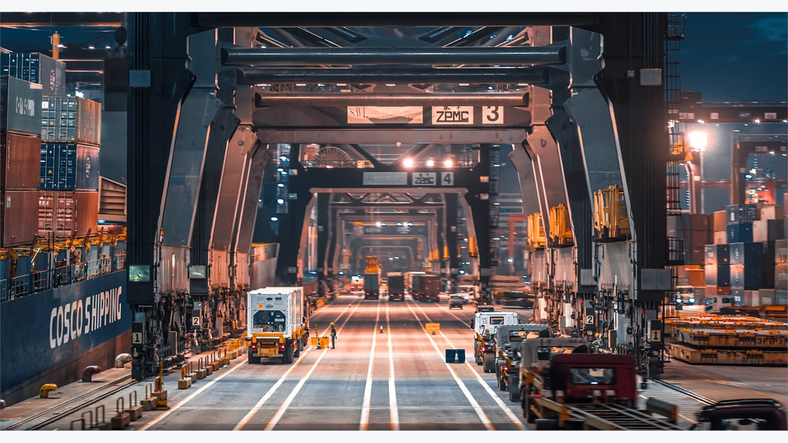night logistics yard with trucks representing timing for orders tracking and exception updates