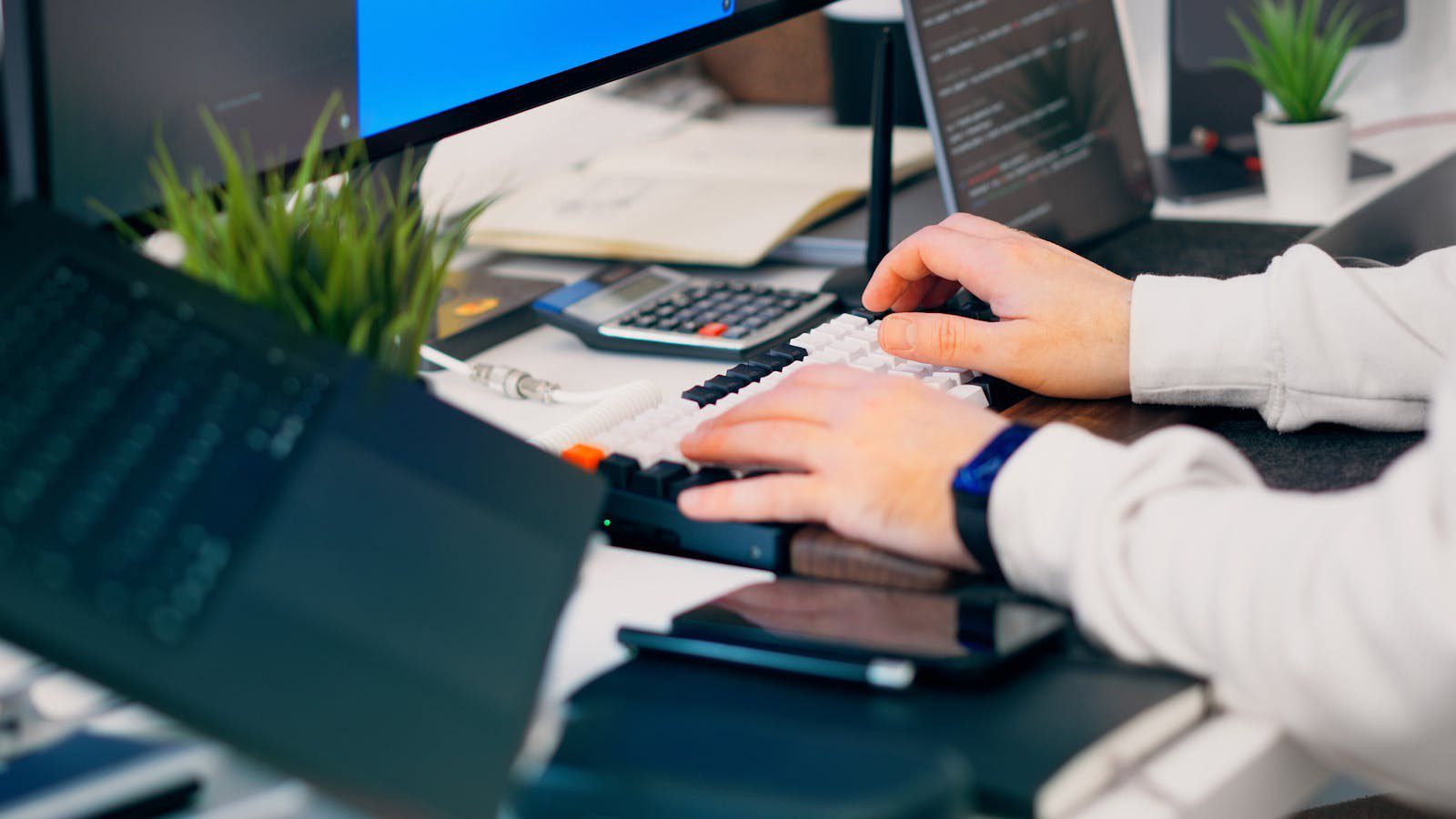 How to Set Up a Secure Remote Work Environment: A Step-by-Step Guide 8 secure remote work environment: monitoring security tasks across screens in a home office.