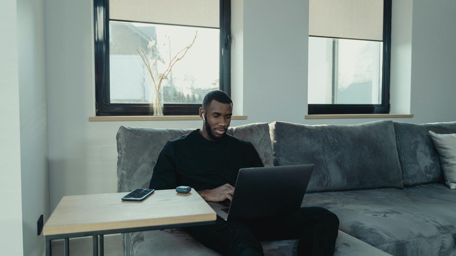 How to Set Up a Secure Remote Work Environment: A Step-by-Step Guide 9 secure remote work environment: a professional working remotely on a hardened laptop from home.