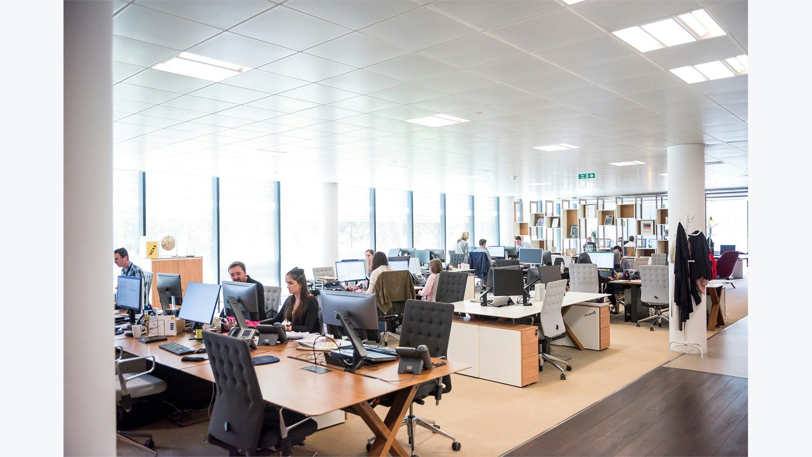 Smart Office Automation: 9 Powerful Energy Wins 14 busy office floor with desks and people for auditing energy use and occupancy patterns