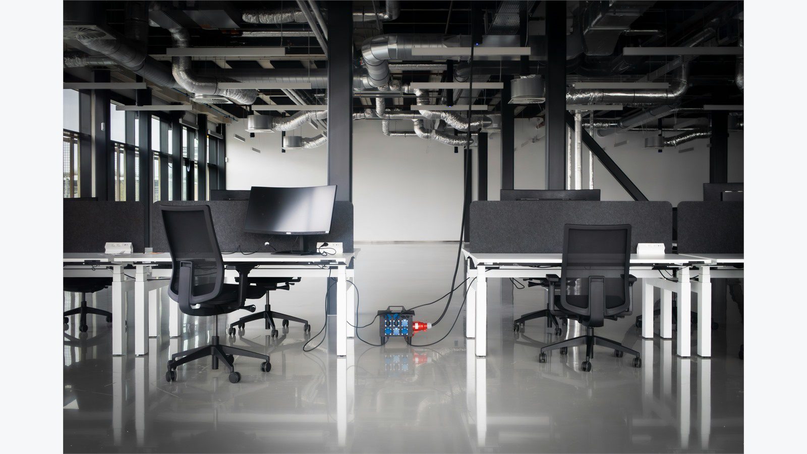 Smart Office Automation: 9 Powerful Energy Wins 20 office with exposed building systems showing BMS IT integration for smart office automation