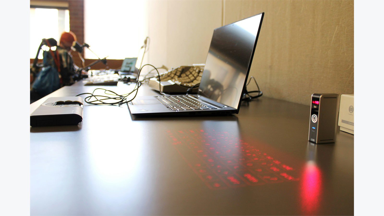 Smart Office Automation: 9 Powerful Energy Wins 17 laptop and office devices on a desk representing plug load control and shared equipment savings