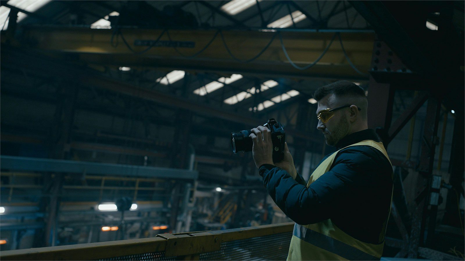 Smart Warehousing Uses IoT and AI: 9 Powerful Wins 17 safety worker using a camera in an industrial facility representing computer vision quality and safety checks