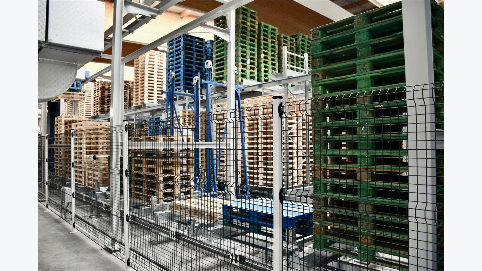 Smart Warehousing Uses IoT and AI: 9 Powerful Wins 14 warehouse pallets racks and automated storage area representing connected inventory assets and locations