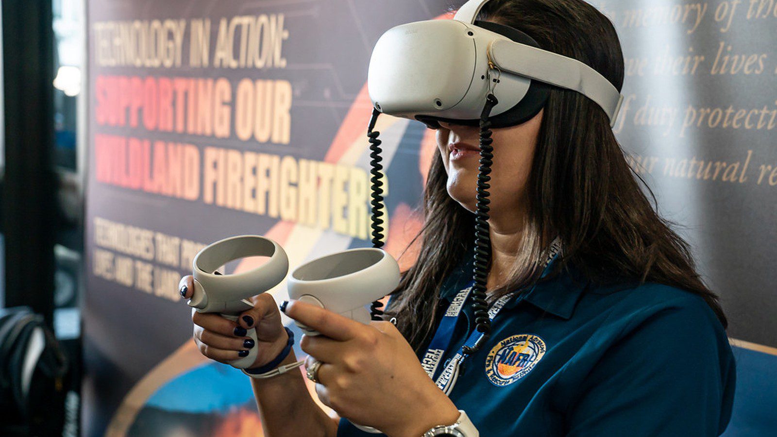 Spatial Computing: employee using a VR headset and controllers for practical training.