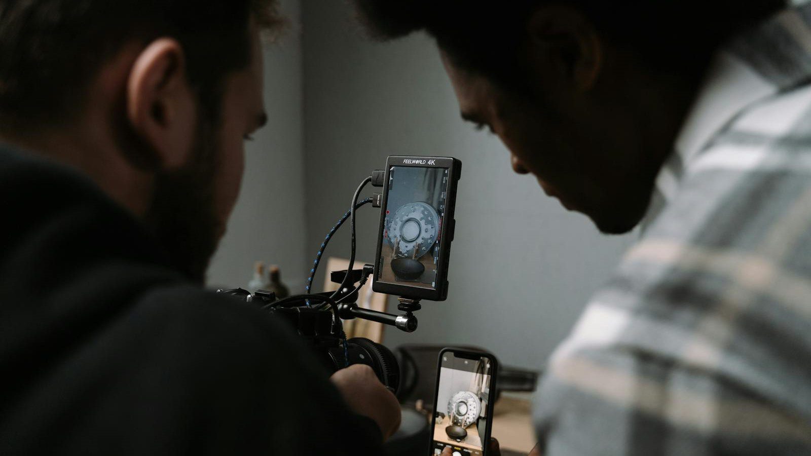 VideoAI AI video generator workflow with creators reviewing cameras editing screens and generated clips