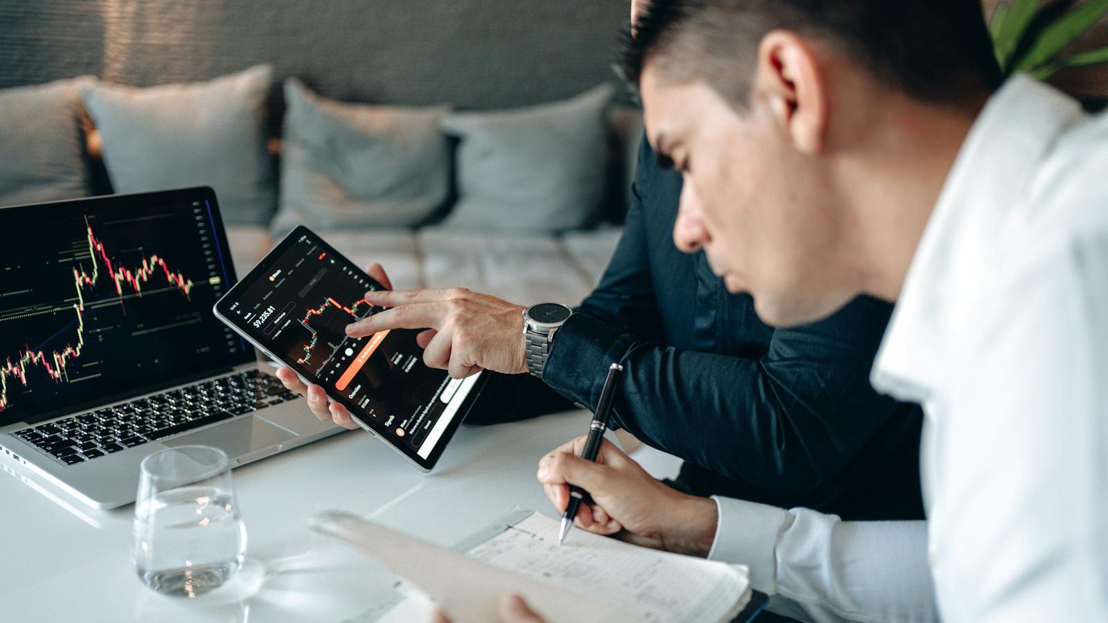 VideoAI Review: 7 Powerful AI Video Wins for Creators 16 team reviewing graphs and data on screens for AI video pricing and credit planning