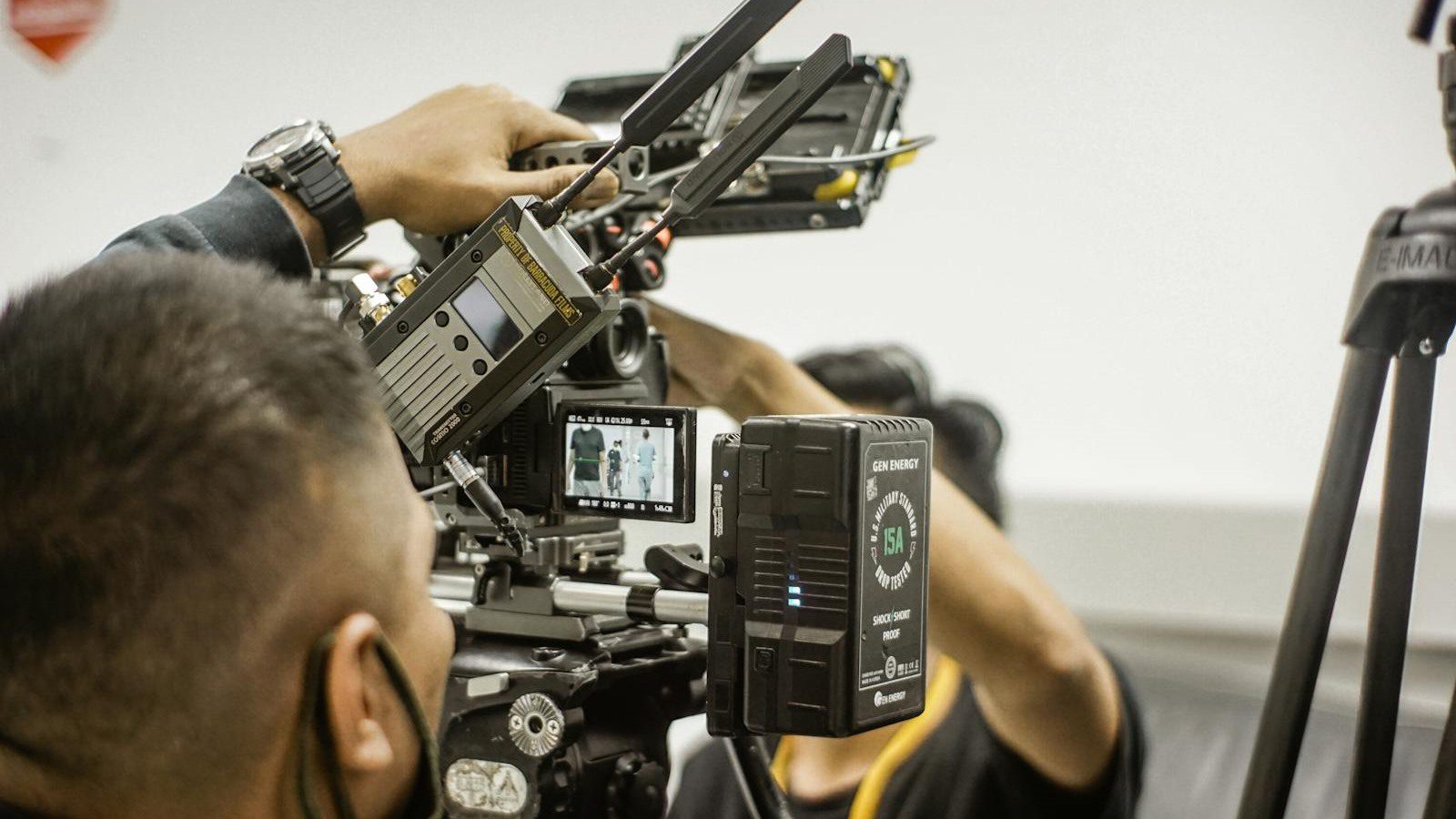 VideoAI Review: 7 Powerful AI Video Wins for Creators 12 professionals adjusting filmmaking equipment for text to video AI content production