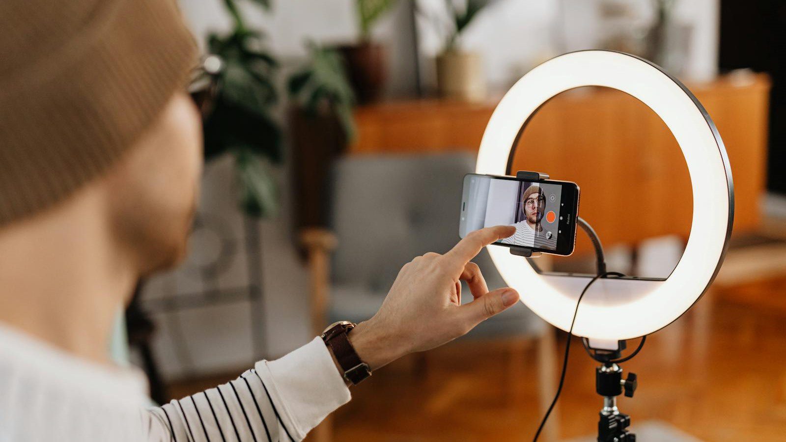 Vimi AI photo to video workflow with a smartphone creator reviewing animated clips and social templates