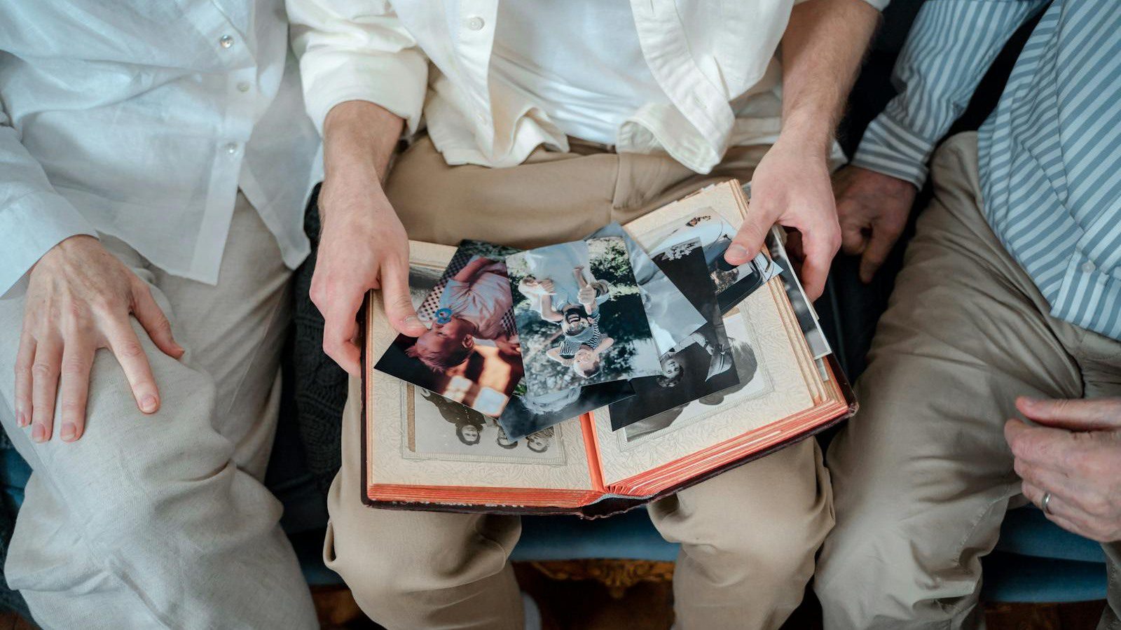 family reviewing old photos representing portraits couples pets and memory videos