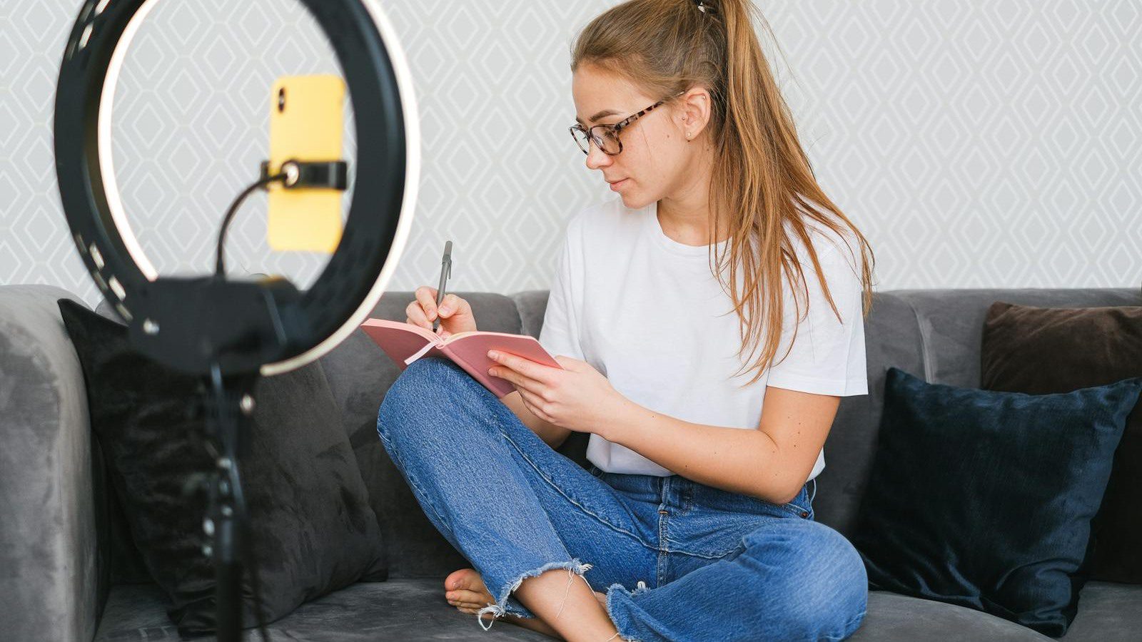 creator writing ideas beside a ring light representing text to video prompts and quick concepts