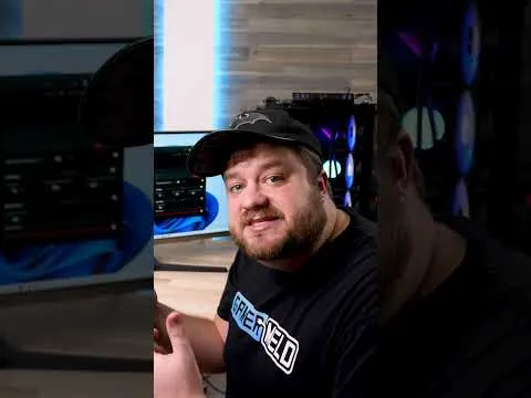 progressive Robot man in a cap sitting at a desk with a PC and monitors, giving a thumbs-up to the camera