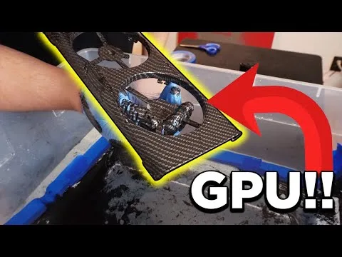 progressive Robot holding a graphics card over a container of dark liquid, with a red arrow pointing to the GPU text