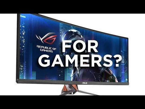 Progressive Robot, curved ASUS monitor displaying "FOR GAMERS?" with Republic of Gamers logo and futuristic character.
