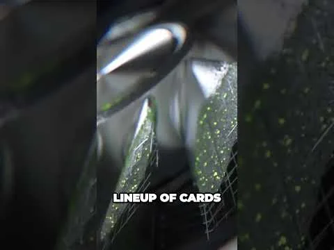 progressive Robot close-up of shiny black surface with green speckles and the caption LINEUP OF CARDS
