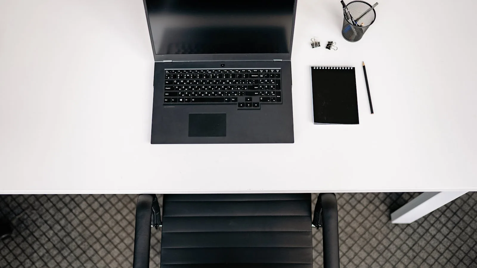 Atomic Bot: 7 Useful Facts About the OpenClaw AI Assistant 27 Top-view desk setup representing practical use cases for a personal AI assistant