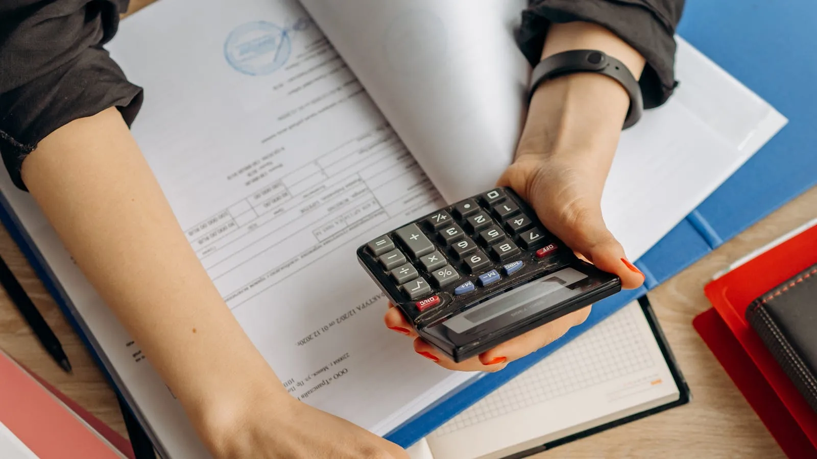 GPT for Work shown in a business operations context with laptop, paperwork, and calculator on a finance desk