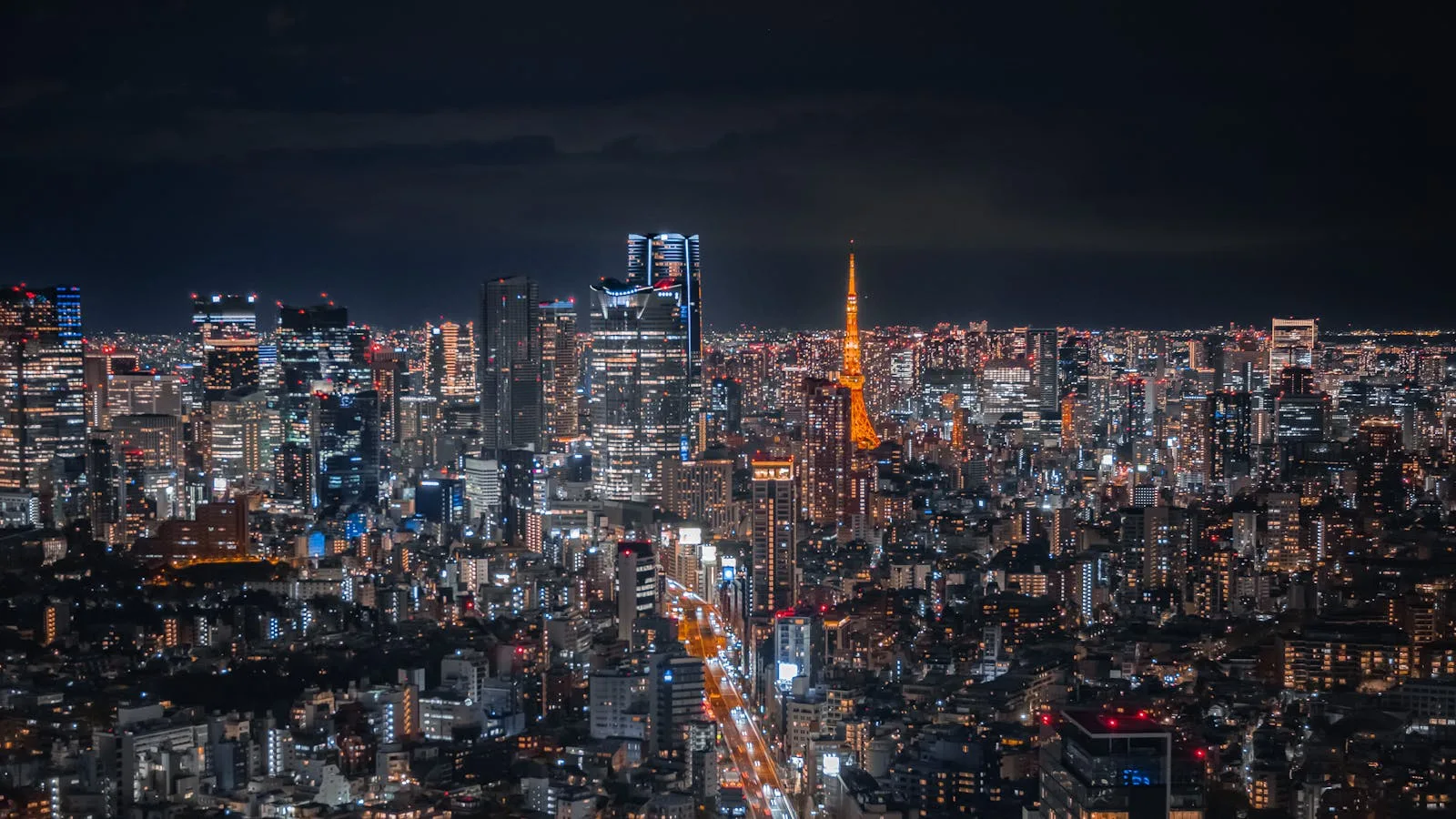 Sony image sensor factory Japan subsidy FAQ illustrated by the Tokyo skyline at night, signaling Japan's broader semiconductor strategy