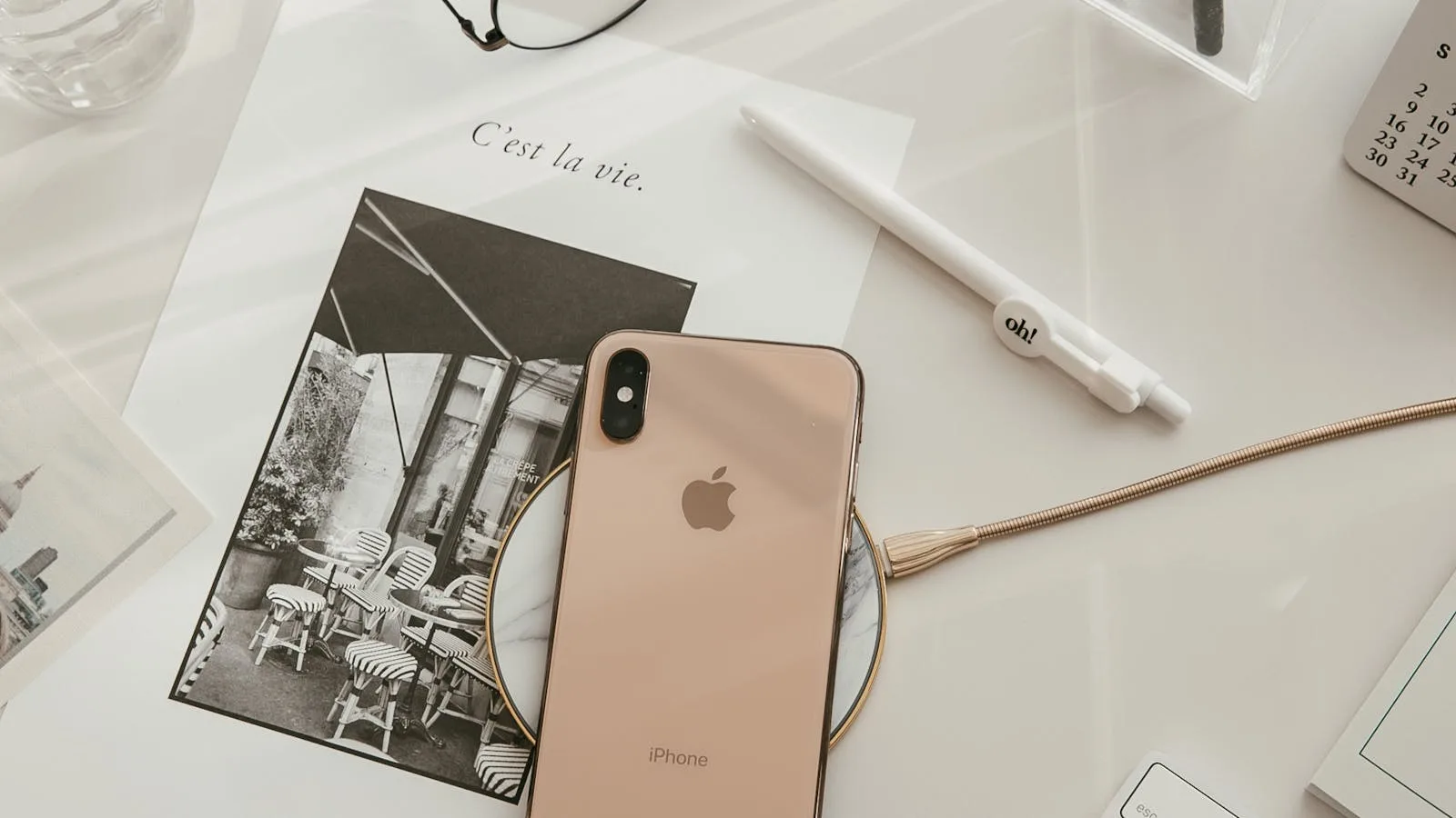 Whacka at a glance represented by a minimalist smartphone workspace with accessories and notebook
