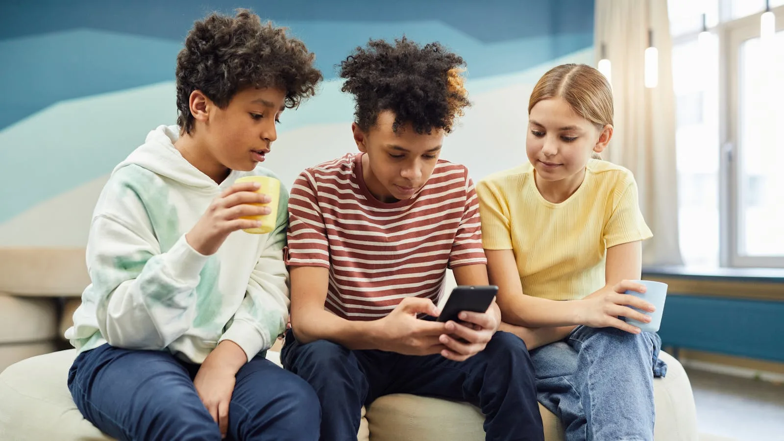 Where Whacka fits best represented by friends using a smartphone together to share a small app