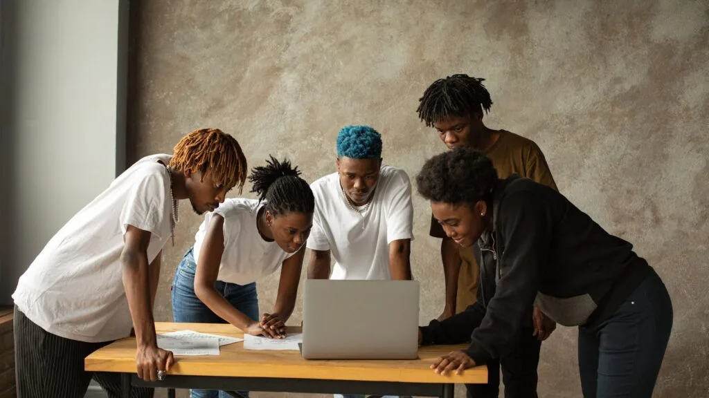 What Is Anymelo? 9 Powerful Facts About the AI Music Generator 26 What Is Anymelo 06 faq team laptop discussion